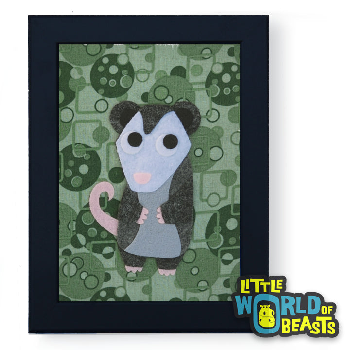 Framed artwork of a cartoon possum on a green patterned background