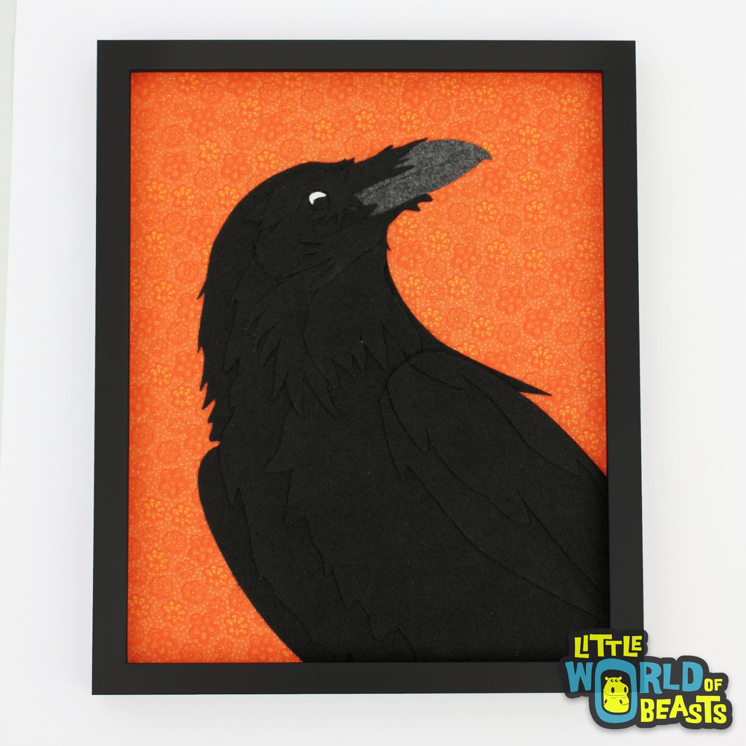 Felt Raven Portrait on a orange background